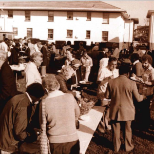 A picture from an OMSC consultation in 1982 subtitled, "disarming stereotypes with a barbecue"